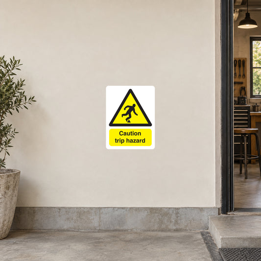 Trip hazard warning sticker, yellow caution triangle with falling figure and “Caution trip hazard” text