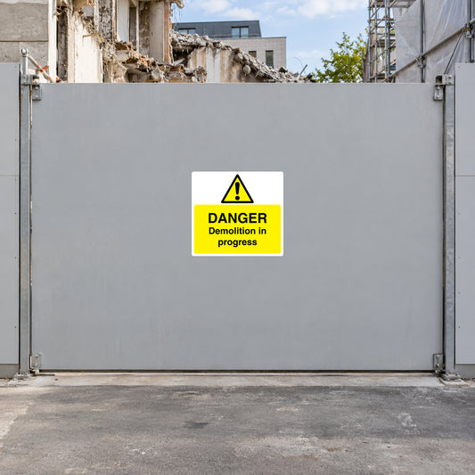 Danger demolition in progress sticker with yellow warning triangle and “DANGER” text