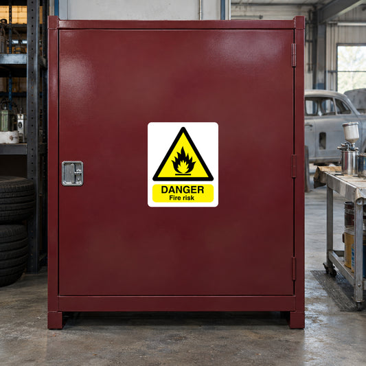 Danger fire risk warning sticker with yellow hazard symbol and red FIRE RISK label