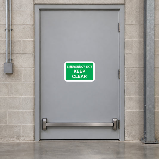 Emergency exit keep clear sticker with green border and white text on door