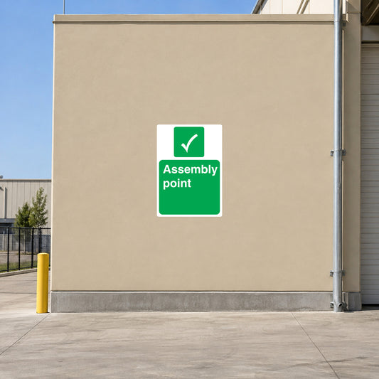 Assembly point sticker with green checkmark and 'Assemble point' text on white square