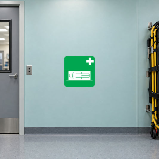Medical help sticker with green square and white medical bed icon plus cross