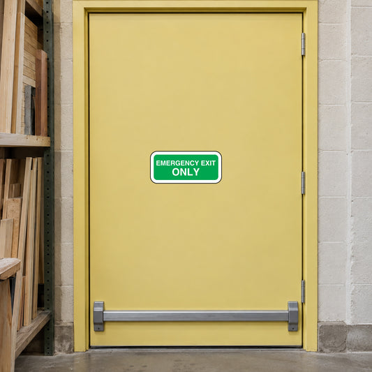 Emergency exit only sticker on door, green text in a rounded rectangle.