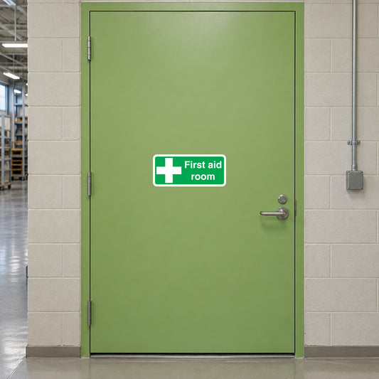 First aid room wall sticker with green background, white cross and text