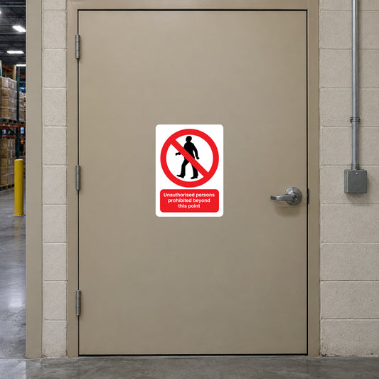 NO Safety Sign Sticker applied in staff-only loading control room entrance, solid muted beige steel door, narrow warehouse sidelight far left