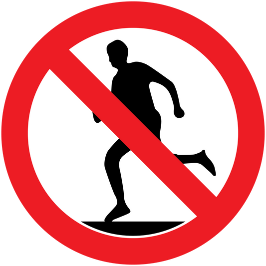 Safety sign sticker with red no-walking symbol and barred silhouette