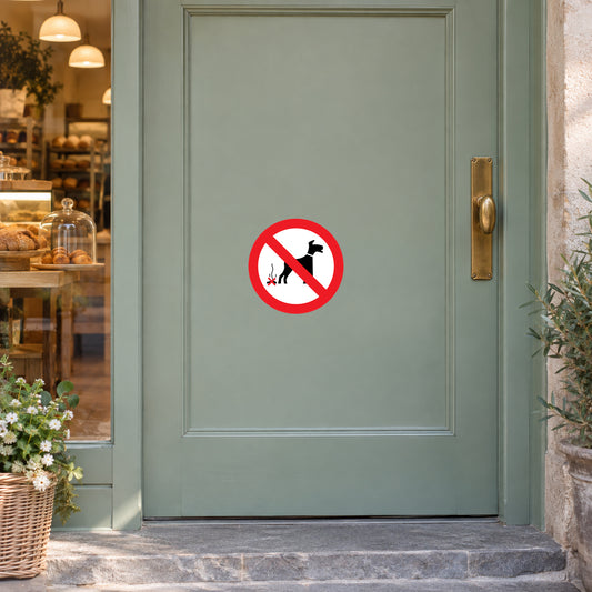 No Dog Fouling sticker displayed on a bakery entrance door