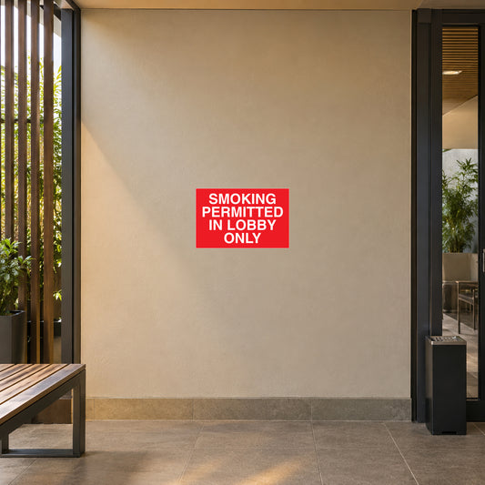 NO Smoking Sign Sticker applied in smooth tan wall at entrance to a separated ventilated designated smoking lobby, empty seating at edge