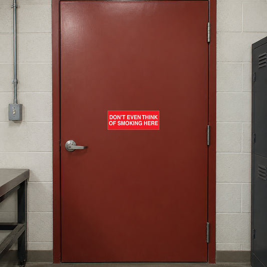 NO Smoking Sign Sticker applied in single muted red workshop breakroom door