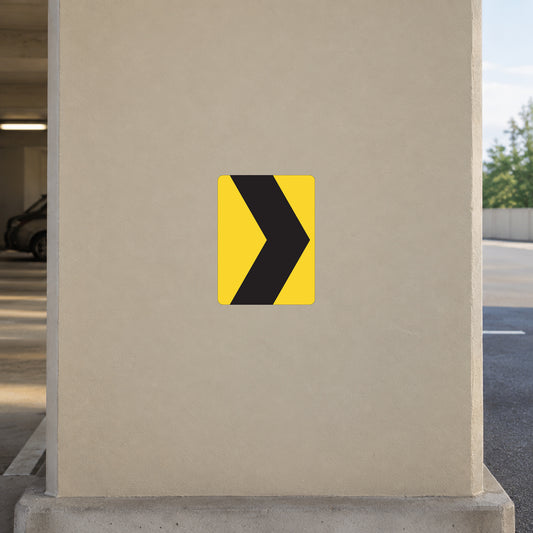 Road sign sticker with yellow background and black right-turn chevron