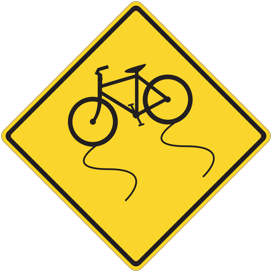 Road sign sticker: yellow diamond with black border and cyclist icon.