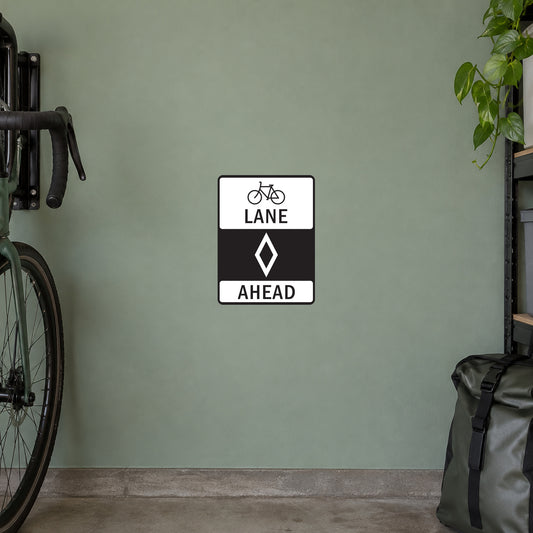 Road sign sticker with bicycle lane icon and text “LANE AHEAD”