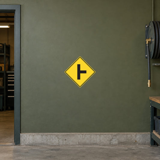 Road sign sticker with yellow diamond and black left arrow
