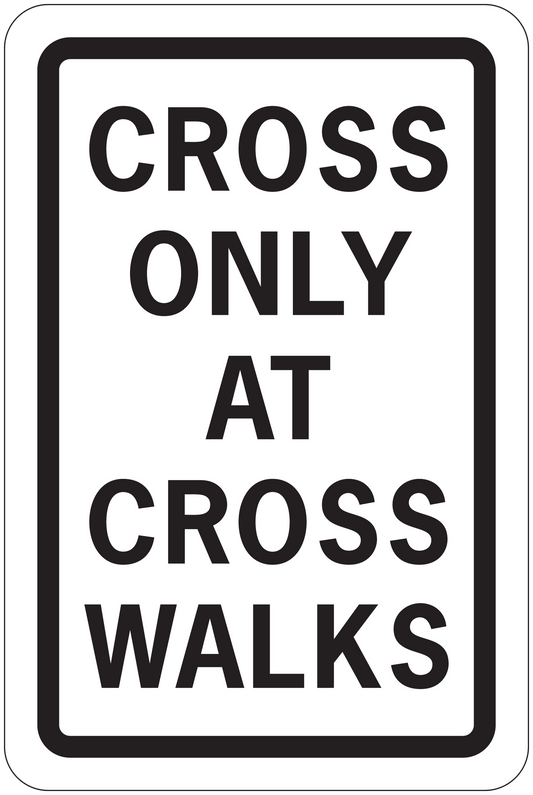 Road sign sticker with text: "CROSS ONLY AT CROSS WALKS"