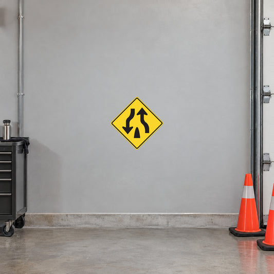 Road sign sticker: yellow diamond with black upward and downward arrows