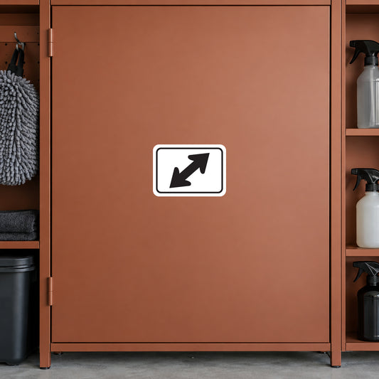 Road Sign Sticker applied in A terracotta private garage storage cupboard with car cleaning mitt extreme left and spray bottles far right, broad blank smooth door