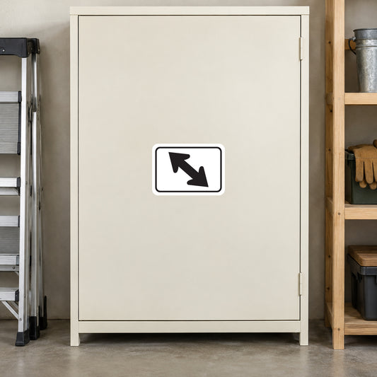 Road Sign Sticker applied in A warm ivory maintenance shed cabinet beside folded step ladder far left and glove shelf far right, single blank smooth front