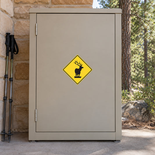 Road Sign Sticker applied in A sandstone wildlife visitor center smooth metal storage cabinet beside hiking pole extreme left and pine woodland at far right, blank central single door