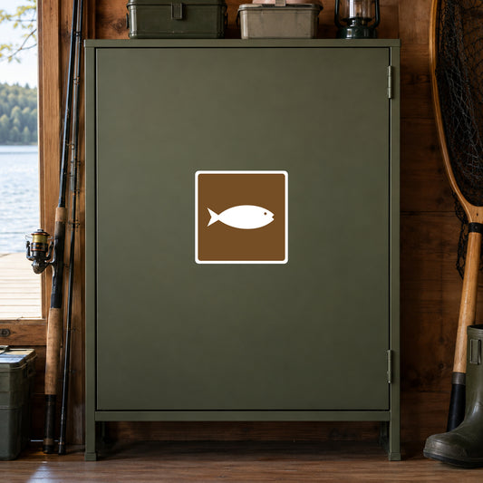 Road Sign Sticker applied in A moss green lakeside tackle room cupboard with fishing reel edge left and landing net extreme right, blank smooth single door