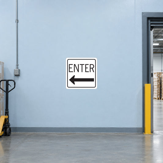 Road Sign Sticker applied in A pale blue warehouse receiving entry smooth wall with pallet jack far left and doorway far right, blank center