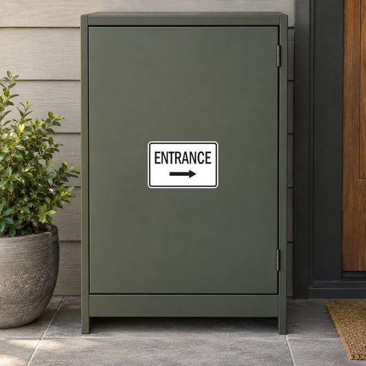 Road Sign Sticker applied in A dark sage business service entry cabinet with parcel shelf extreme right and potted plant low left, single blank smooth door