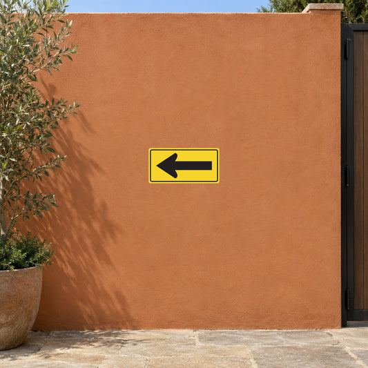 Road sign sticker with black left arrow on yellow border