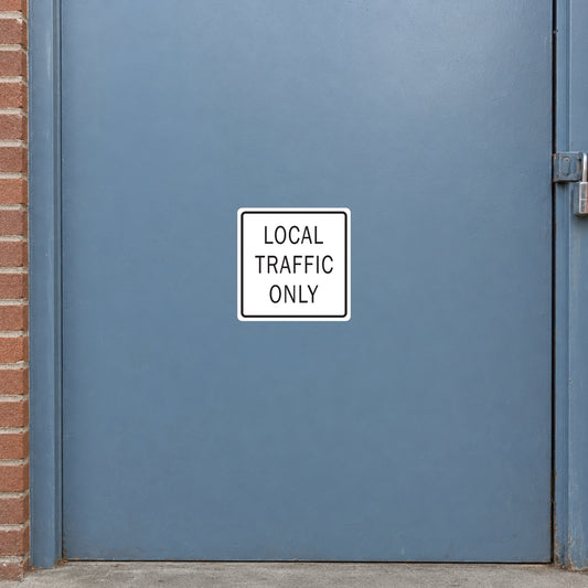 Road sign sticker: square white badge reading “LOCAL TRAFFIC ONLY”