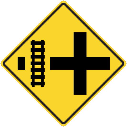 Yellow road sign sticker with black cross and vertical measurement marks