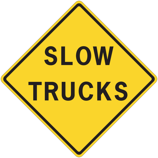 Yellow road sign sticker with black "SLOW TRUCKS" text, diamond shape