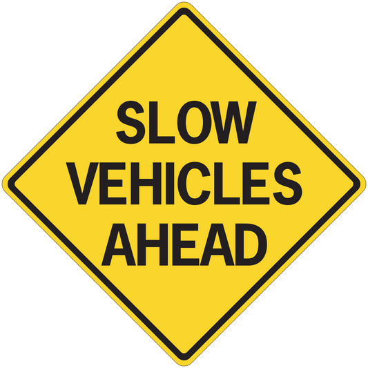 Road sign sticker with yellow diamond and text SLOW VEHICLES AHEAD
