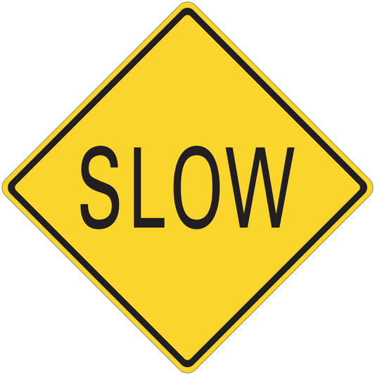 Road sign sticker: yellow diamond with black border and “SLOW” text