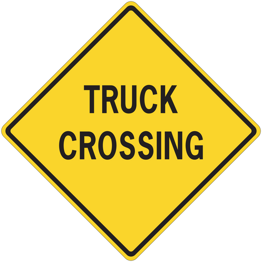Yellow road sign sticker with black TRUCK CROSSING text in a diamond