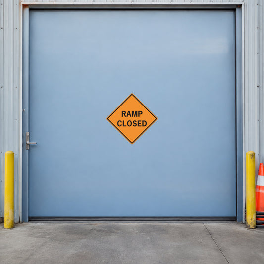 Orange road sign sticker: "RAMP CLOSED"
