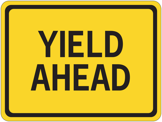 Yellow road sign sticker reading "YIELD AHEAD" with black border