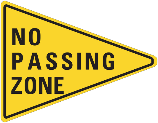 Yellow road sign sticker with black border reading "NO PASSING ZONE"