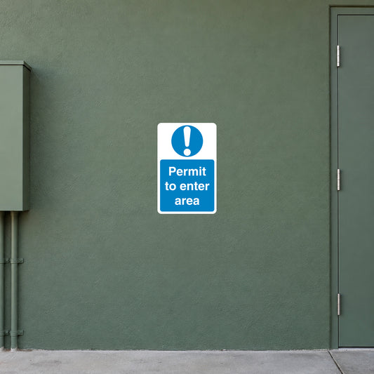 Safety Sign Sticker applied in a smooth muted green wall at a restricted utility access entrance, document box far left and closed access door far right