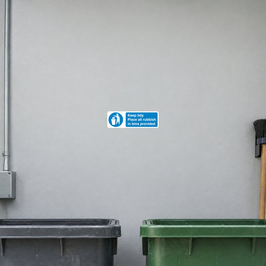 Safety Sign Sticker applied in a smooth pale grey wall above factory rubbish bins, bin rims below y85 and sweeping brush extreme right, central blank