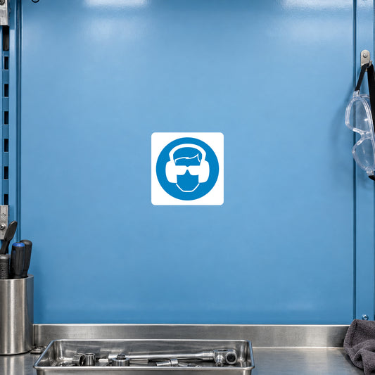 Safety sign sticker with blue-and-white PPE mask icon in a square