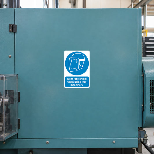 Safety sign sticker with blue face-shield icon and warning text