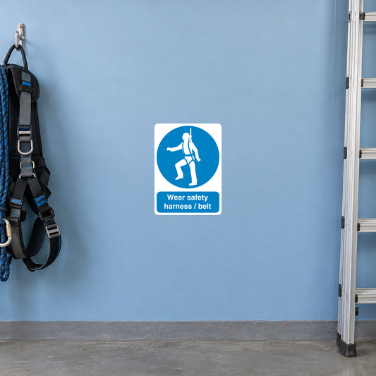 Safety sign sticker: blue harness icon with text 'Wear safety harnesses/belt'