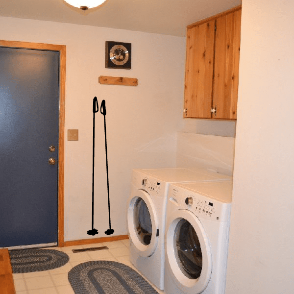 Skiing wall decal with two crossed skis and poles