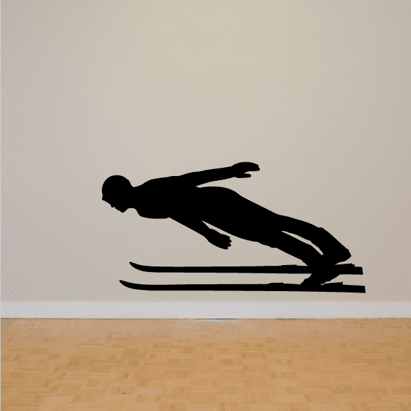 Black skiing wall decal with skier silhouette sliding on skis