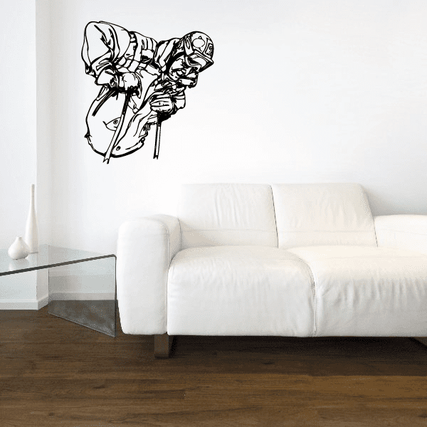 Skiing wall vinyl decal featuring a skiwear character silhouette