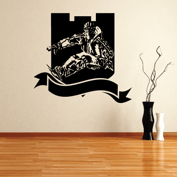 Skiing vinyl wall decal with black skier silhouette and curved banner ribbon