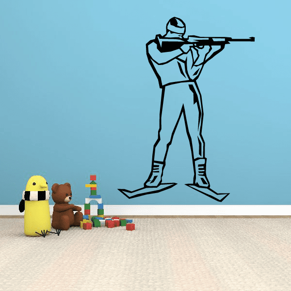 Skiing wall decal: black outline skier holding skis, vinyl car-style sticker