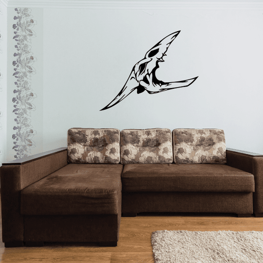 Black skull wall decal with stylized winged design