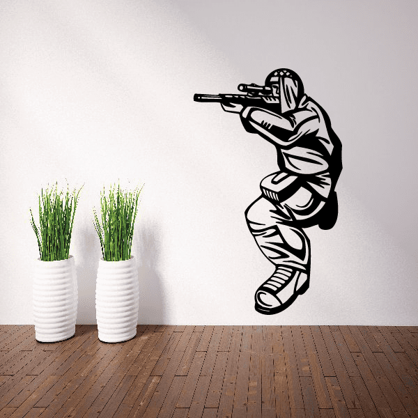 Sniper paintball player vinyl decal, black-and-white figure aiming paintball gun.