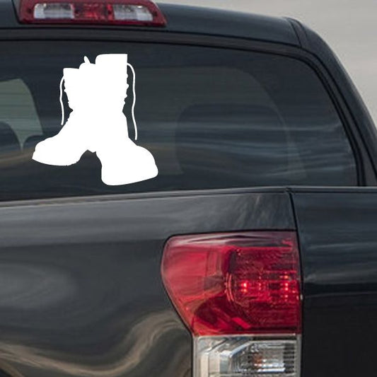 White soldier boot vinyl decal on car rear panel near taillight