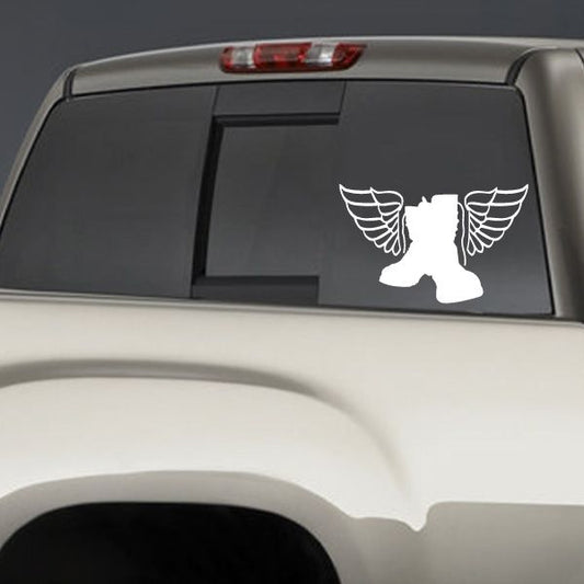 Winged boot silhouette decal with white boots and wings on dark surface