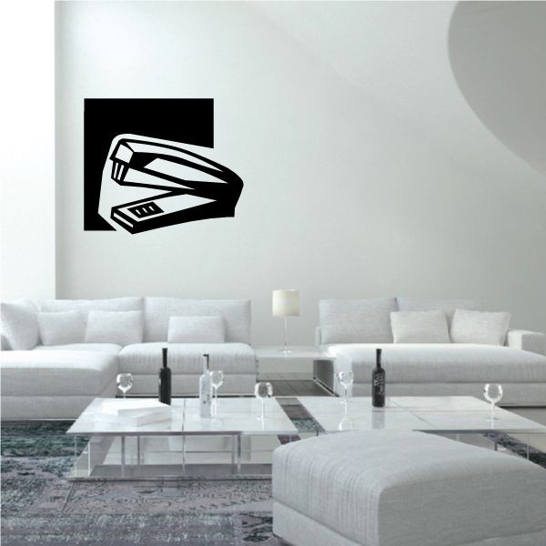 Stapler wall decal with black square background and white stapler icon